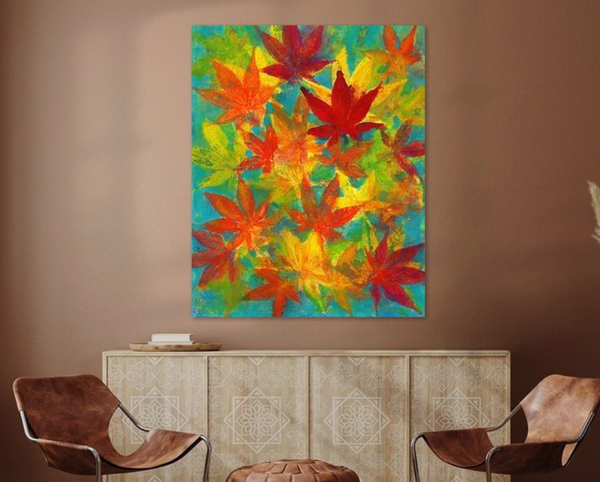 Colorful maple leaves is an acrylic painting in vertical format painted by artist Karen Kaspar. Colorful maple leaves in all rainbow colors yellow, orange, red, green, blue and purple are happily dancing across the paper in this acrylic painting.
The painting hangs in a living room.