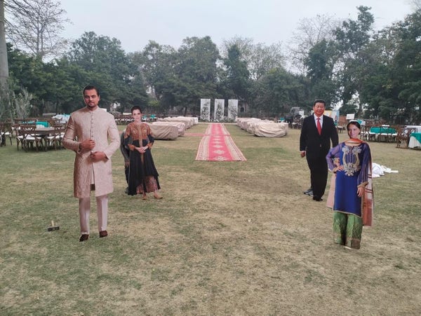 Four of the celebrity cut-outs during pre-event prep, in traditional Pakistani clothes. From let to right - Leonardo dicaprio, Emma Watson/Hermoine, President Xi Jinping, Greta Thunberg.