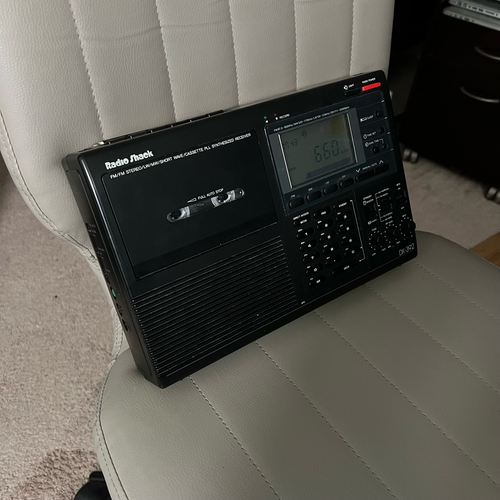 A Radio Shack DX-390 receiver sitting on a swivel chair.