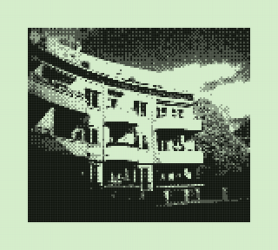 A residential building in the sun, against the blue sky, highly pixelated