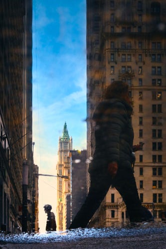 Two people are seen in the reflection of a puddle. On either side there are large buildings that extend upward out of frame.

One of the people reflected is in the foreground on the right in front of a building. The other person is in the distance, silhouetted by the sky in the canyon between buildings.

Farther in the distance, a gothic building with a green pointy roof rises above other buildings.