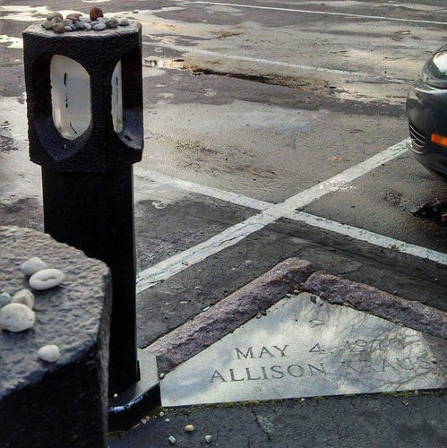 Memorial marker in the parking lot where Allison Kause, 19, was killed along with , 19, Jeffrey Glenn Miller, 20, Sandra Lee Scheuer, 20, and  William Knox Schroeder, 19, when Ohio National Guard troops fired on student protesters and passersby, May 4, 1970. Nine students were wounded.