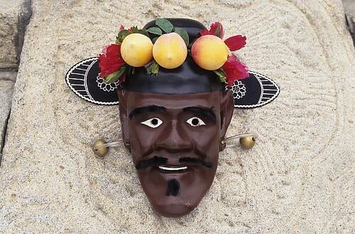 The mask in Cheoyong's likeness worn to perform the dance in honor of him. It depicts a smiling dark-skinned man with a broad nose, fruits and flowers in his horsehair hat.