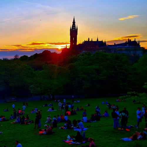 The sun setting behind Glasgow University as seen from the nearby Kelvingrove Park.