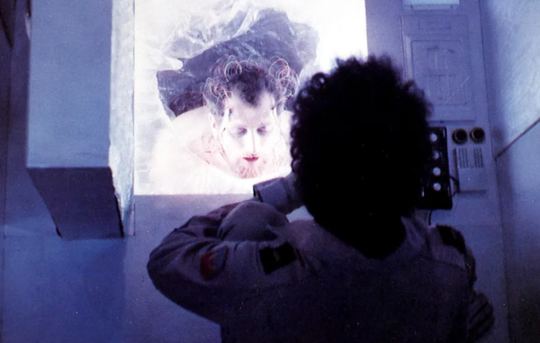 Dark Star movie screenshot - a man is in a cryosleep chamber
