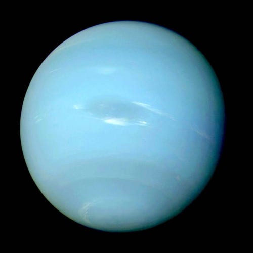 Picture of Neptune taken by NASA's Voyager 2 spacecraft in 1989 and reprocessed in 2024 to reflect the true color of the ice giant -- a paler turquoise similar to Uranus than previously shown.
