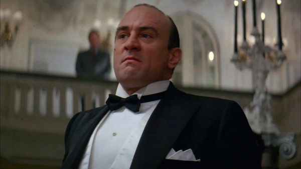 An image of Robert De Niro playing Al Capone in Brian De Palma's "The Untouchables". He looks very similar to Bob Hoskins.