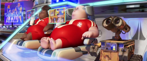 Still image from Wall-E showing human beings incapable of doing anything for themselves.