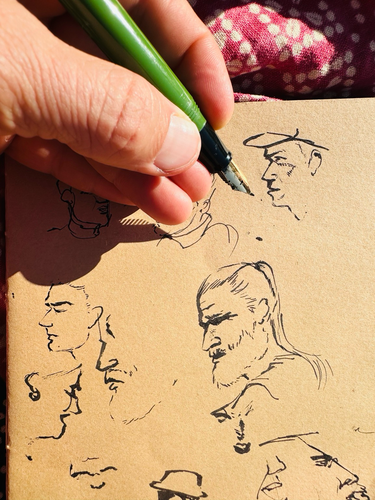 Sketchbook page with peoples faces