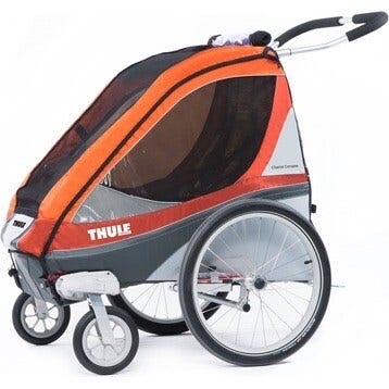 Oranger Veloanhänger für Kind von Thule. Modell Chariot Corsaire 1