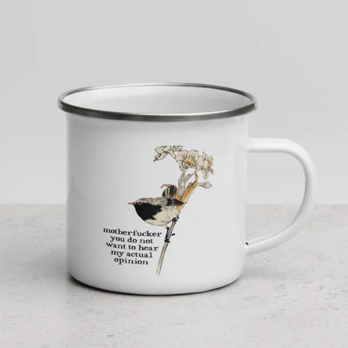 A photograph of an enamel mug featuring a painting of a bird above the words “motherfucker you do not want to hear my actual opinion “