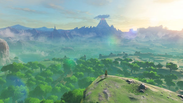 A screenshot from Breath of the Wild, showing Link standing on a cliff looking out at Hyrule during the opening cutscene.