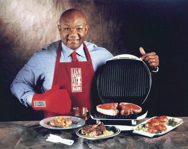 This is a promo pic with everyone's favorite boxing legend turned grillmaster - George Foreman.

I saw him fight Ali when I was a kid and didn't like him (everybody loved Ali), but in later years, a minister and entrepreneur he became a beloved figure in American society.

This is an official promo pic of the "Original" George Foreman grill. I think the modern one's are junk compared to this - it is an awesom kitchen appliance, but space restrictions in most kitchens, coupled with the fact that you have to take care not to submerge it when cleaning might be why it's not so ubitquitous today.