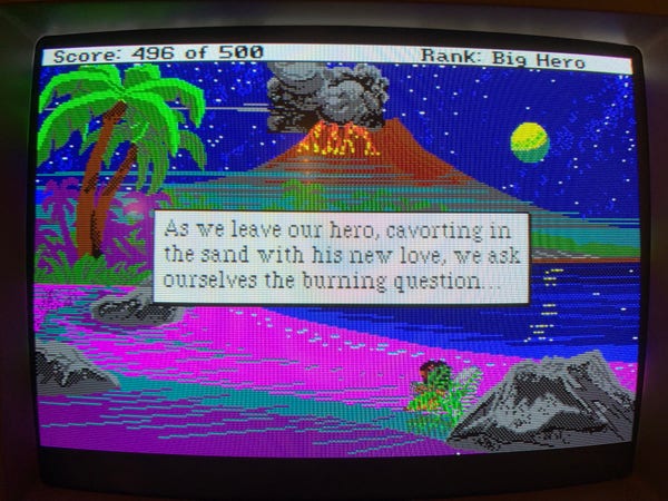 A tropical beach scene at night, in 16 color pixelated graphics. The text saying: As we leave our hero, cavorting in the sand with his new love, we ask ourserlves the burning question...