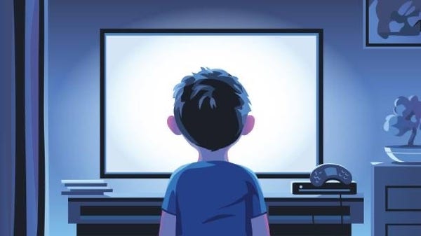 Boy staring at a tv playing games 