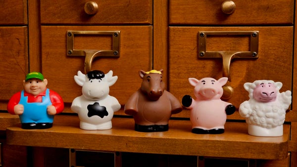 Photo of a series of small plastic children's toys with a farm theme. Left to right: a farmer, a cow, a horse, a pig, and a sheep.

Except, the animals have the size and posture of people, not actual animals.
