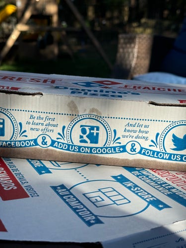 Picture of a pizza box, on the side it says “add us on Google ”