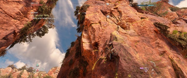 Screenshot of Horizon Forbidden West, showing the character climbing up a rock wall. Glowing yellow lines and X marks are visible on the surface of the rock, showing locations that you can grip and climb to.