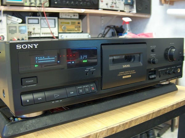 Sony TC-K515S cassette deck sitting on an electronics workbench.