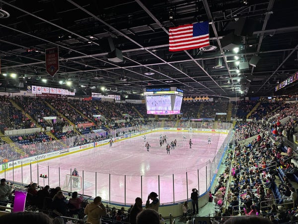 The MassMutual center hockey rink, filled with spectators and face off ready to happen at the start of the game.