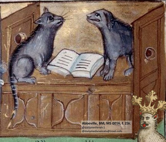 Picture from a medieval manuscript: A cat and a dog sit opposite each other. An open book lies between them.