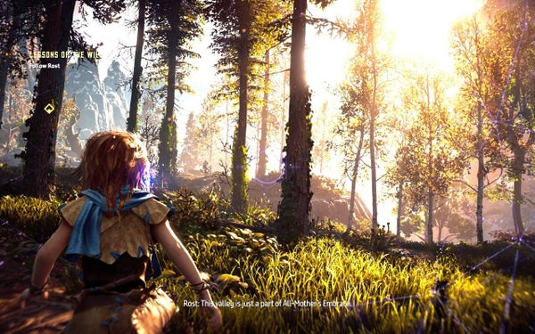 A screenshot from the tutorial of "Horizon Zero Dawn". Young Aloy is looking off into the first; a bright sun shining thru the trees and grass towards her.
