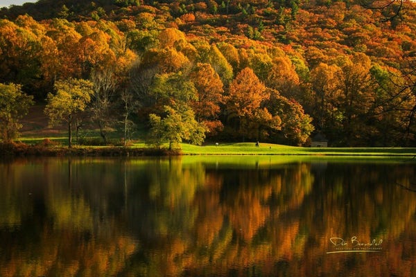 Photograph of Abbott Lake reflecting a tapestry of autumn trees in a stunning array of oranges and reds at Peaks of Otter, Virginia. Image at:  https://beautifulsunphotography.com/featured/autumn-at-abbott-lake-deb-beausoleil.html See more art & blog at: https://beautifulsunphotography.com/ https://debbeautifulsunphotography.com/ https://www.zazzle.com/store/beautifulsun_designs https://debbeausoleil.com