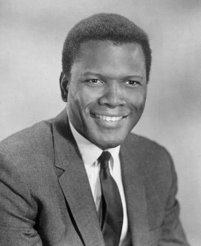 Black and white photo of Sidney Poitier wearing a suit and tie
