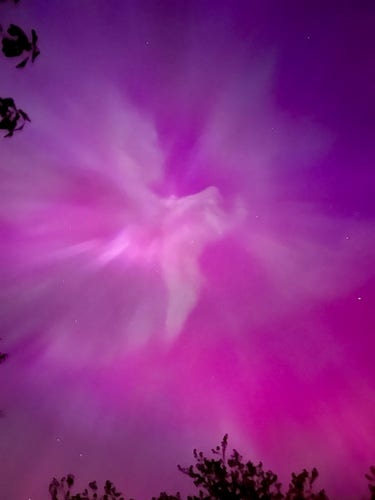 Purple aurora opening up a portal in the sky