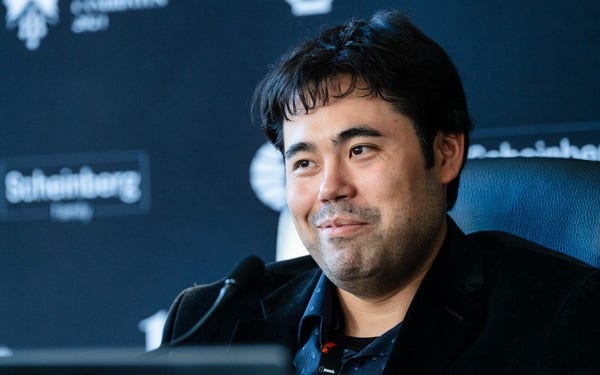 Photo of Hikaru Nakamura smiling at the press conference after Round 8 of the 2024 Candidates (Credits: FIDE / Maria Emelianova)