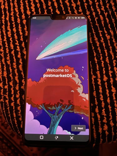 A OnePlus 6 running Plasma Mobile 6 (postmarketOS edge), showing the Welcome screen in dark mode.