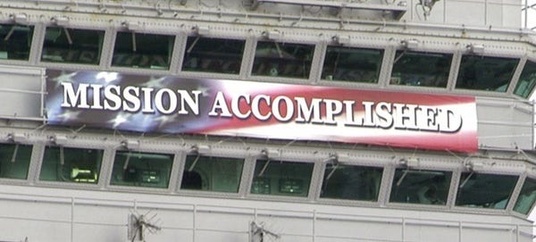 Banner with the text "MISSION ACCOMPLISHED" on the USS Abraham Lincoln