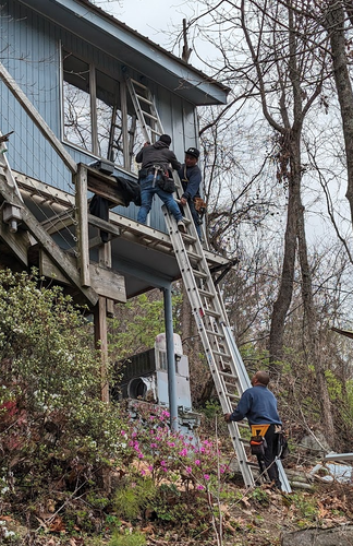 3 scarily talented men on ladders residing a house. My house. 