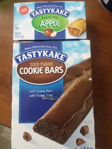 Yesterday I discovered that Tastykake does have now what they call Iced Fudge Cookie Bars. They are close relatives to the fudge bars I remember but different some. Also smaller than the fudge bars that were 25 cents apiece.

Also pictured is a Tastykake pie. Back in the 90s, retail price was 69 cents for a single serving pie. But they would often have 2 for 1 dollar sales at Wawa convenience stores.