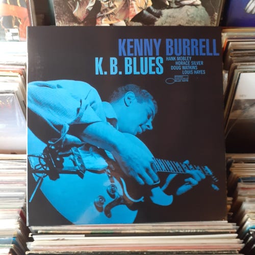 Album cover features a blue tinted b&w photograph of KB playing an electric guitar.