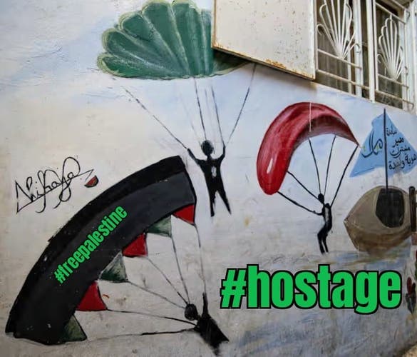 Mural showing Hamas handgliders taking #hostage.