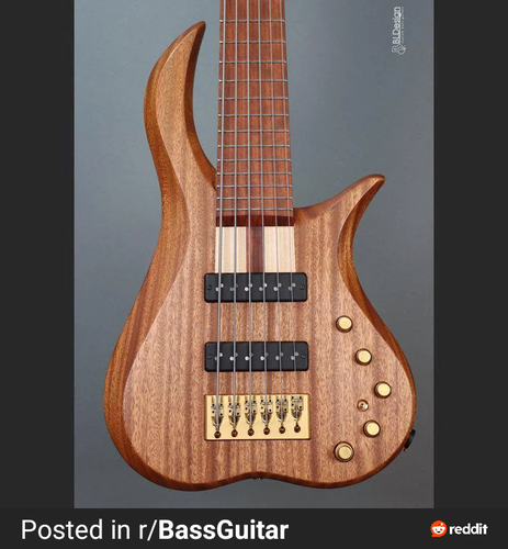 A six-string bass guitar. The wooden body looks a bit like an ass.