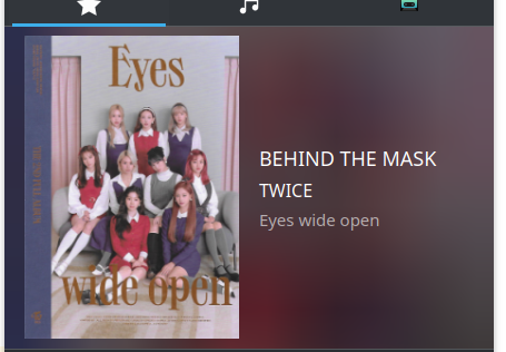 A music player, inside of KDE plasma desktop, a MPRIS media manager.

The Title is: "Behind the Mask", inside of the Album "Twice, By "Eyes Wide Open"
