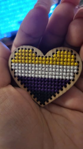 nonbinary flag stitched into wood