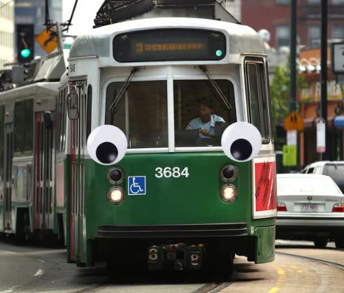 Artist's representation of a Green Line trolley with googly eyes