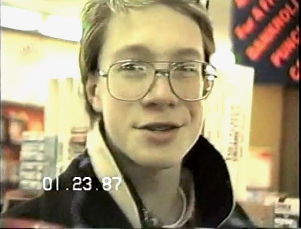 teen boy from video camera still wearing glasses