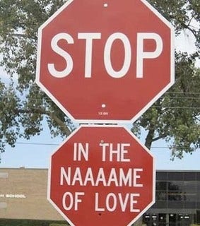 "STOP" sign with smaller sign affixed underneath "IN THE NAAAAME OF LOVE"