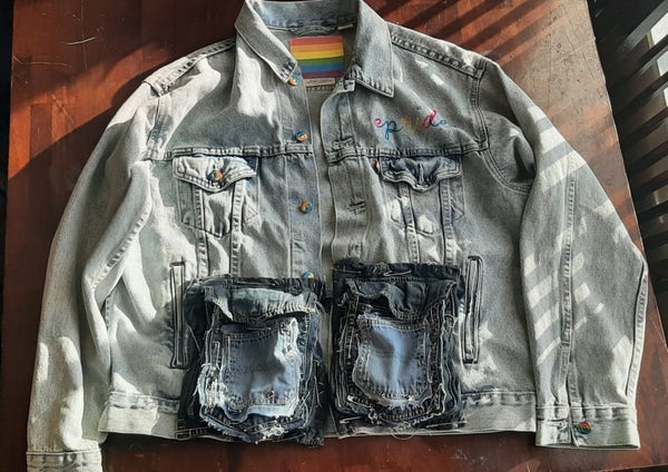 levis pride denim jacket with cargo pockets sewn on top and two more layers of pockets atop that