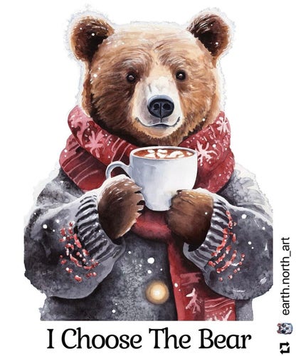 A bear wearing a gray sweater and red scarf, holding a big mug of hot cocoa in both front paws. Below the bear, text reads “I Choose The Bear”. In the bottom right corner is the source: earth.north_art on Instagram