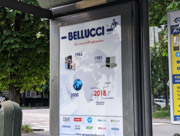 A bus shelter ad for Burlucci, marking milestones in computing, ending in 2018.