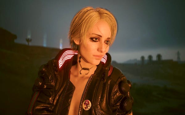 A fire lighting up V‘s face in the night in the badlands. She looks like Ciri from The Witcher 3. 