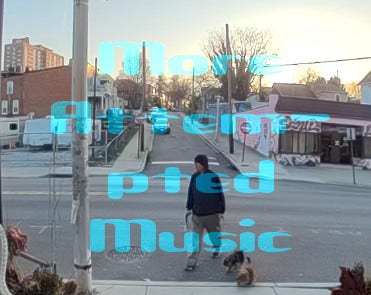 YT Thumbnail: "More Attem-pted Music."
Street scene from the side of a two lane state road, looking across traffic and up a side street. I'm in the foreground, in khakis and a blue hoodie - walking my two terriers back to the porch, from whence the video for this song was recorded.