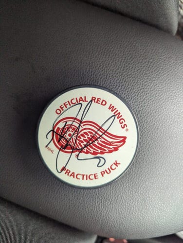 Looking for help identifying a signed puck