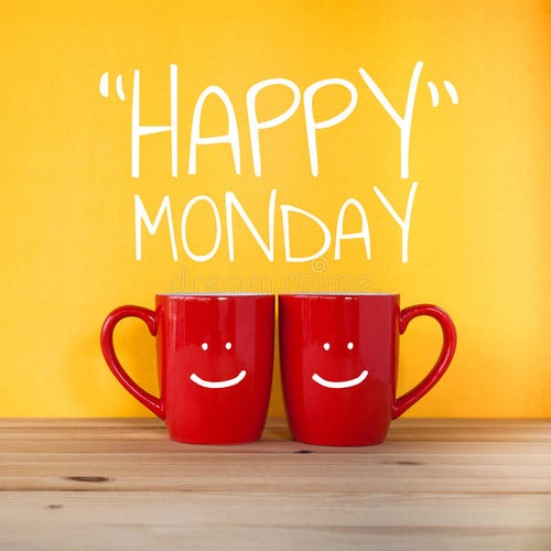 The image features two red mugs with smiling faces on them, placed side by side on a wooden surface. Behind the mugs is a vibrant yellow background with the phrase "Happy Monday" written in white, playful lettering. The overall mood of the image is cheerful and bright.