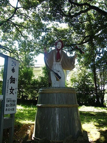 The statue of Ame-no-Uzume at Amanoiwato-jinja on a sunny day in Japan 